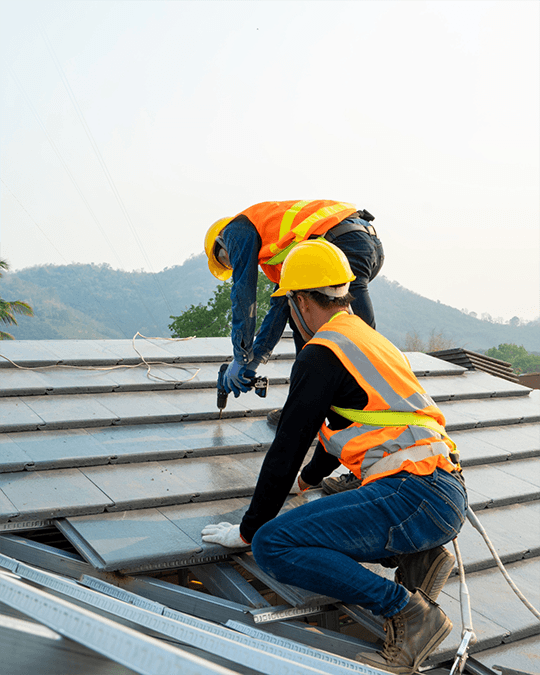 Professional roofer performing roof maintenance and repair